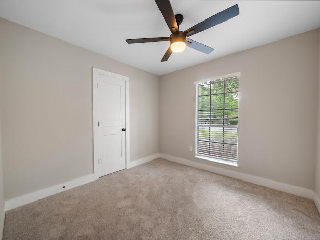 6180 Old Hickory Road Crestview, FL 32539 - Photo 21 of 31 an empty room with windows and fan