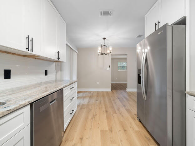 6180 Old Hickory Road Crestview, FL 32539 - Photo 6 of 31 a kitchen with stainless steel appliances granite countertop a refrigerator and a sink