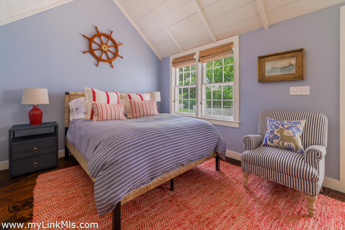 14 & 16 Coffin Street Nantucket, MA 02554 - Photo 12 of 50 a bedroom with a bed and a couch