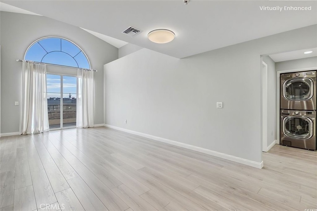 6800 Corbin Avenue, Unit 308 Reseda, CA 91335 - Photo 3 of 11 a view of a room with wooden floor and ceiling fan