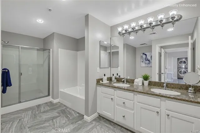 a spacious bathroom with double vanity and a mirror