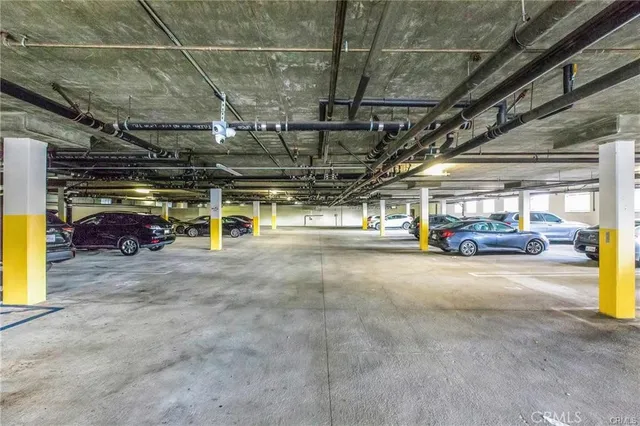 a view of parking garage with cars