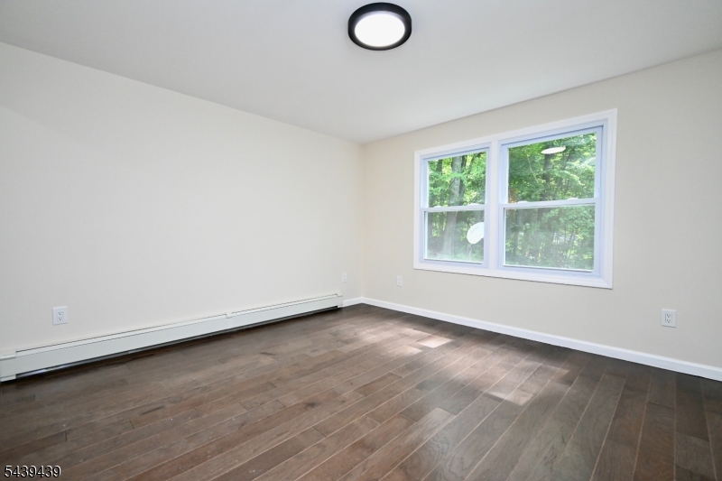 1 Appleseed Road Sussex, NJ 07461 - Photo 10 of 19 an empty room with wooden floor and windows