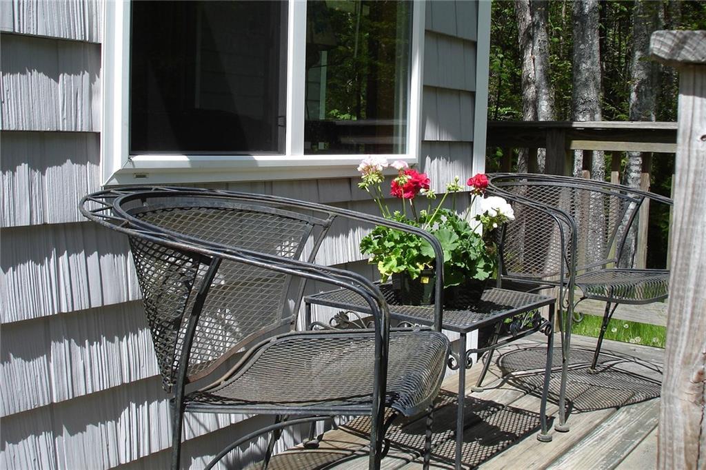 23 Ledgemere Road Orrs Island, ME 04066 - Photo 10 of 14 Small deck surrounds the building