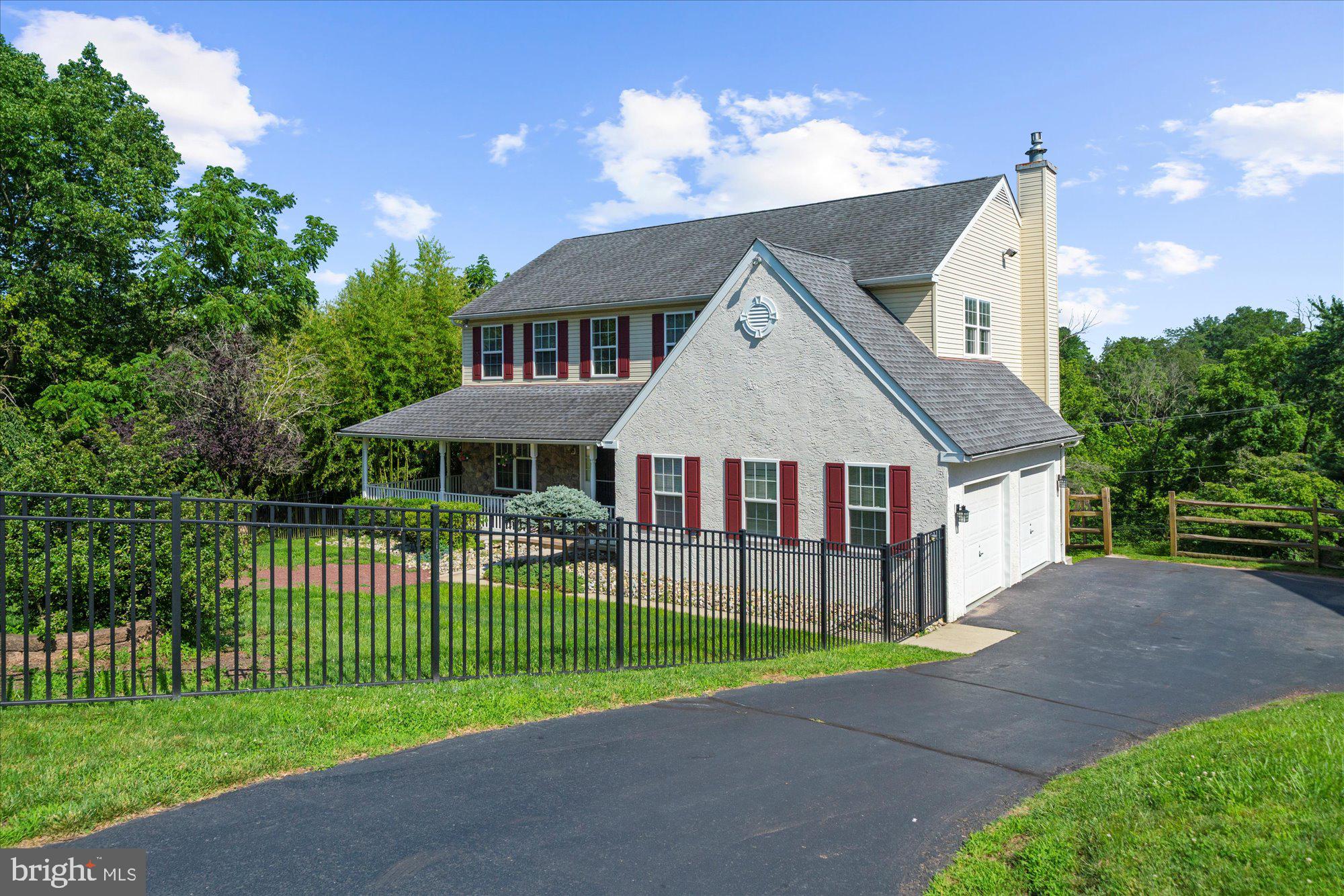 131 Appledale Road Norristown, PA 19403 - Photo 1 of 50 a front view of a house with a garden and plants