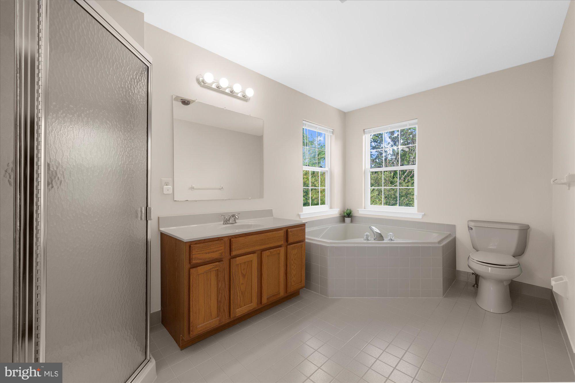 131 Appledale Road Norristown, PA 19403 - Photo 23 of 50 a bathroom with a tub sink toilet and mirror