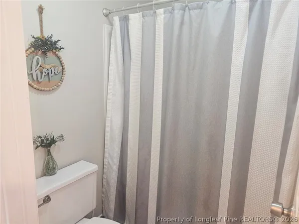 a spacious bathroom with a double vanity sink and a mirror