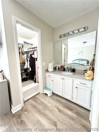 a swimming pool with trees in the background