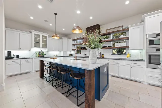 a kitchen with a sink and cabinets