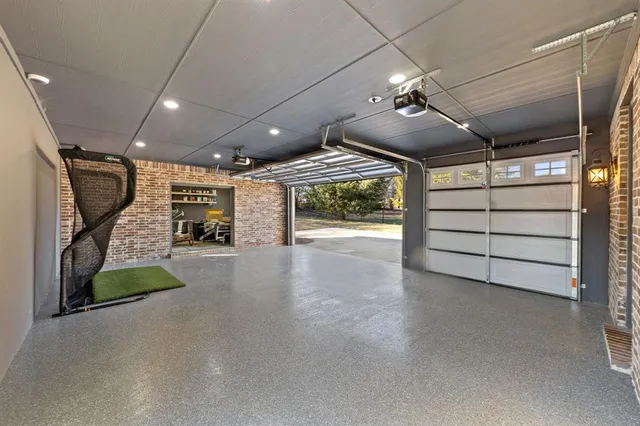a view of a livingroom with furniture and a garage
