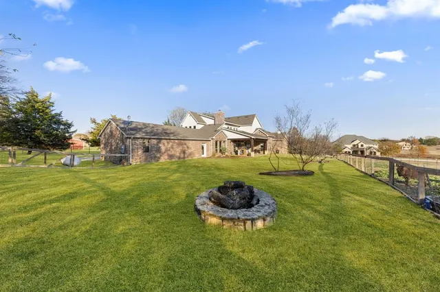 a big yard with table and chairs