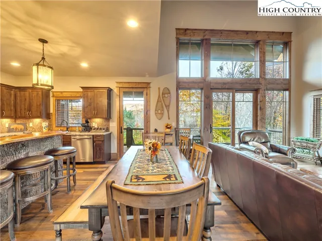 a large kitchen with a table and chairs