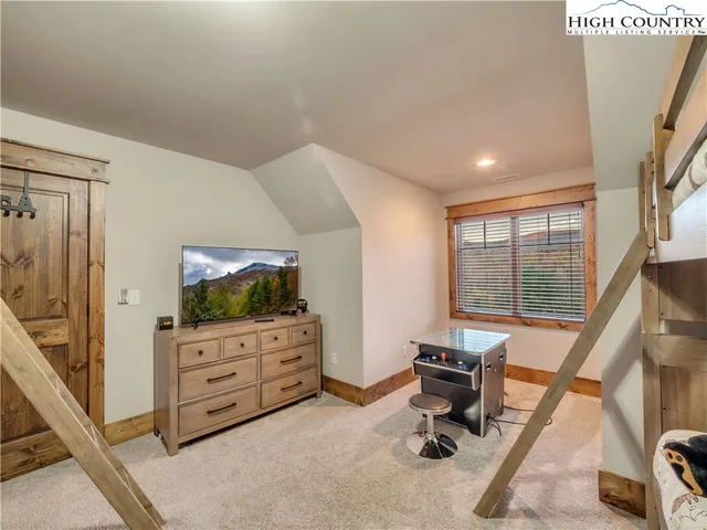 a livingroom with furniture and a flat screen tv
