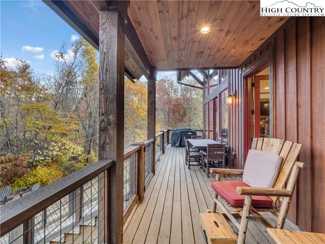 a view of a balcony with chairs