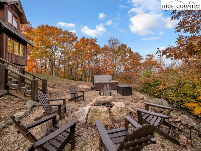 a view of a patio with iron fence