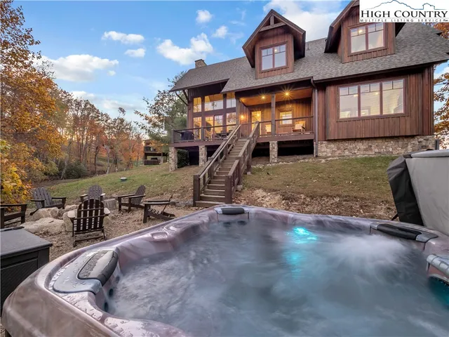 a view of a house with a wooden fence