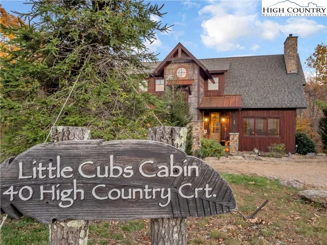 a front view of a building with a sign board