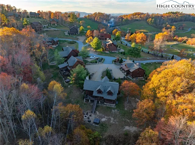 an aerial view of a house with outdoor space