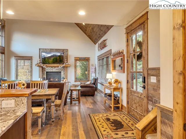 a living room with fireplace furniture and a flat screen tv