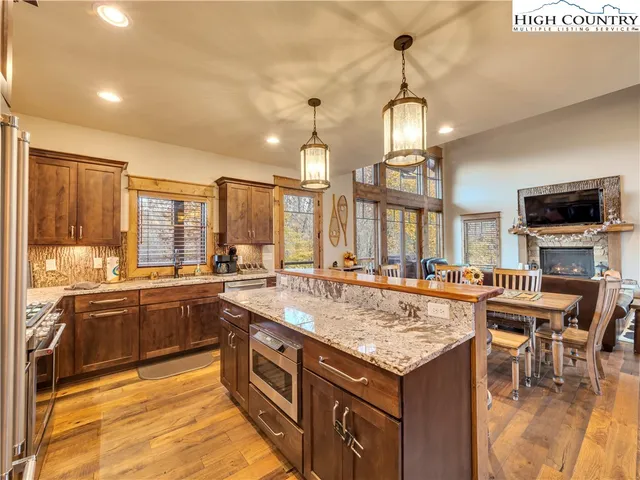 a kitchen with a stove and a center island
