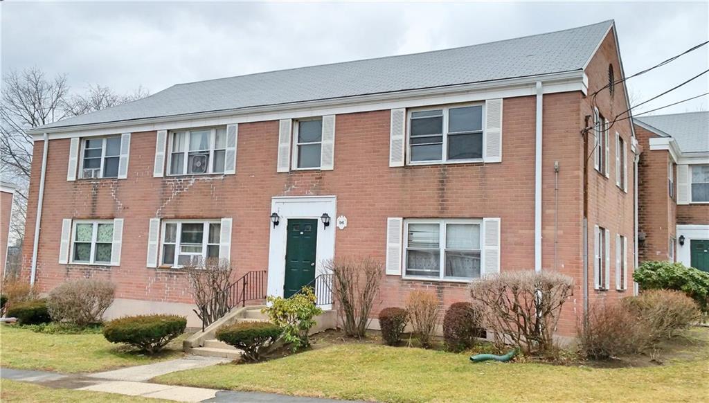 96 Seaton Road, Unit 4 Stamford, CT 06902 - Photo 1 of 1 a front view of a house with a yard