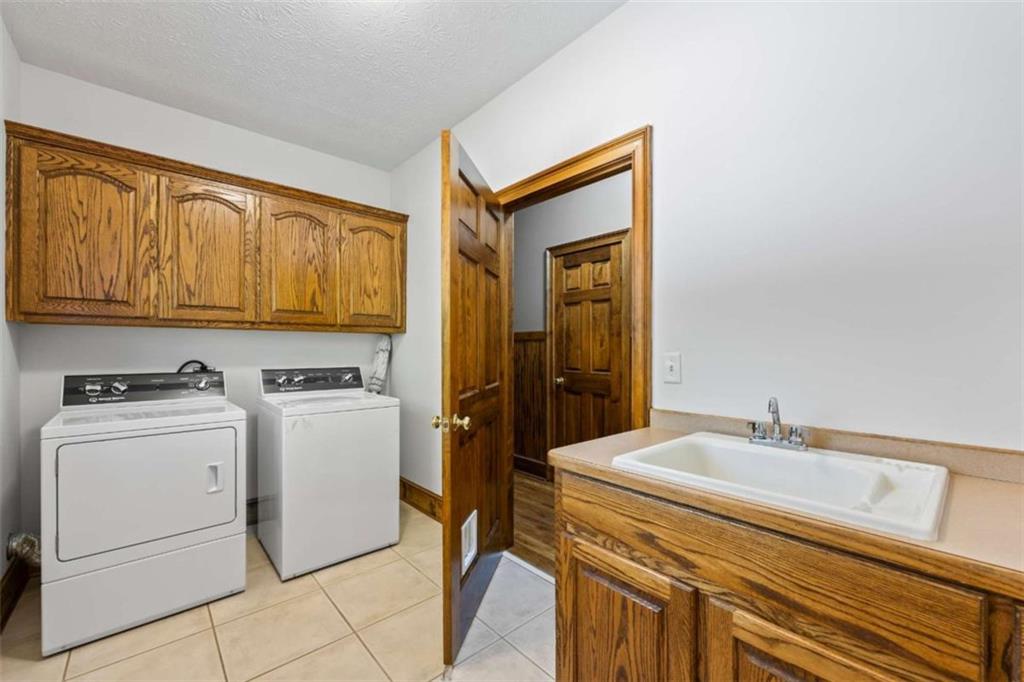 3651 Chandler Haulk Road Loganville, GA 30052 - Photo 20 of 33 a utility room with dryer and washer