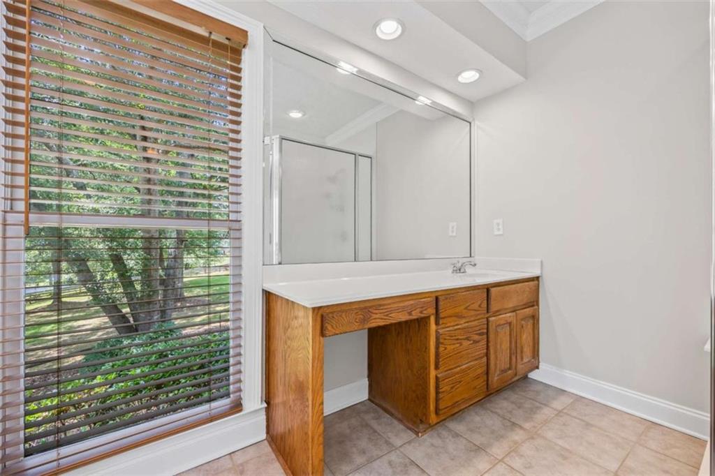 3651 Chandler Haulk Road Loganville, GA 30052 - Photo 23 of 33 a bathroom with a sink and a mirror