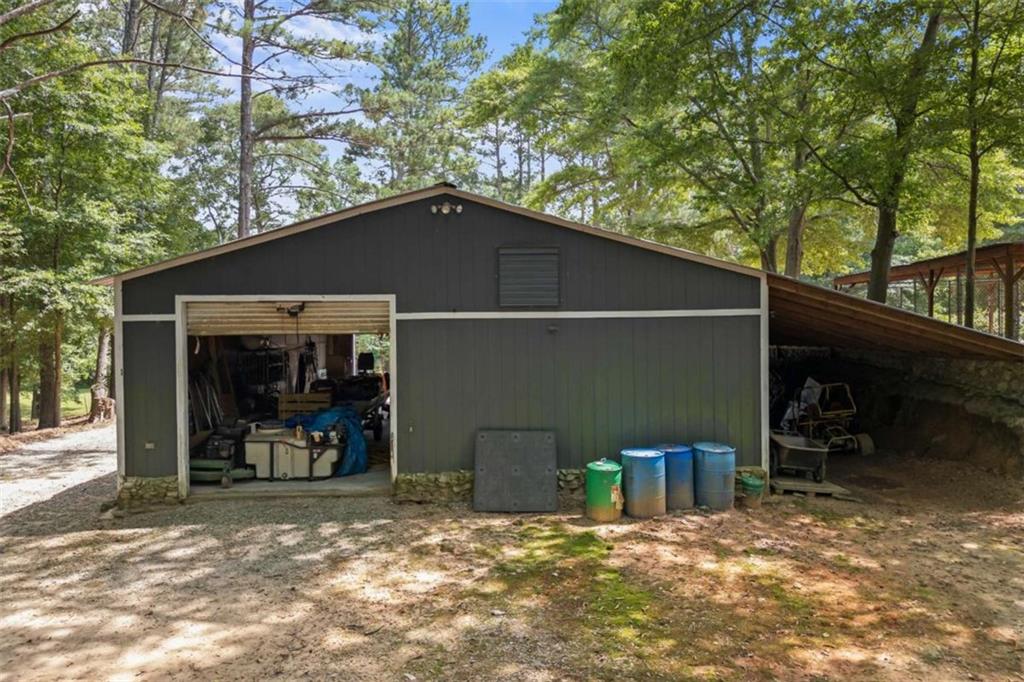 3651 Chandler Haulk Road Loganville, GA 30052 - Photo 31 of 33 a backyard of a house with table and chairs