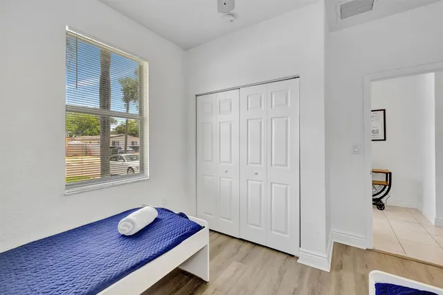 a view of workspace with wooden floor and window
