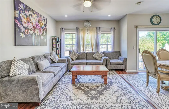 a living room with furniture or couch and a large window