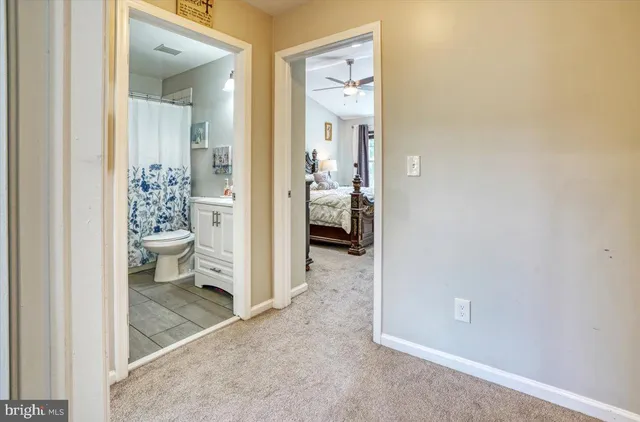 a view of a bathroom from a hallway