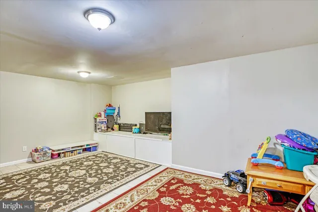 a room with toys and a wooden floor