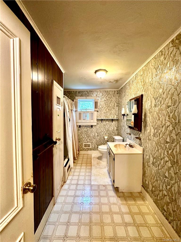 112 Eldred-Yulan Road Eldred, NY 12732 - Photo 23 of 26 a living room with a couch and a flat screen tv