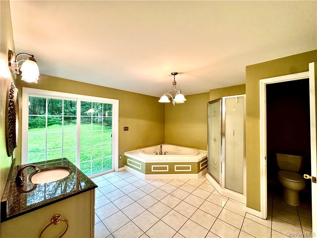 112 Eldred-Yulan Road Eldred, NY 12732 - Photo 24 of 26 a bedroom with a bed and a large window