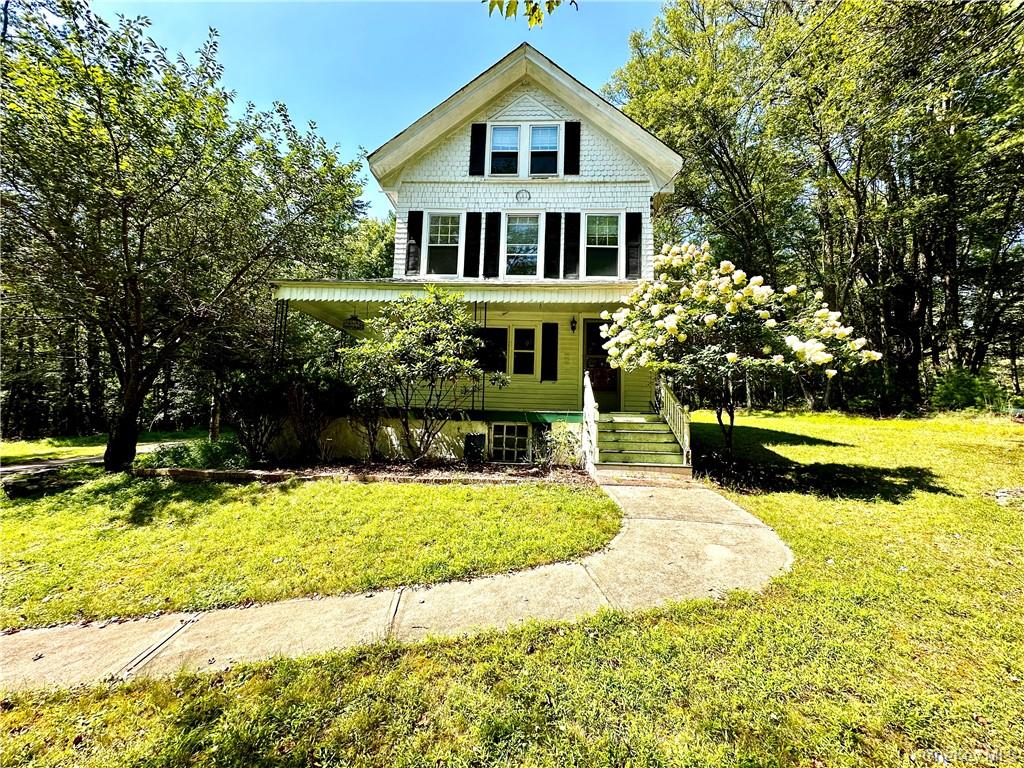 112 Eldred-Yulan Road Eldred, NY 12732 - Photo 5 of 26 a front view of a house with a yard