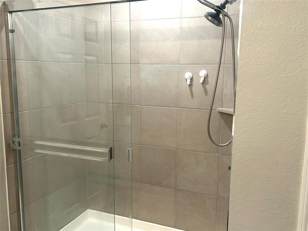 455 Manchester Street Van Alstyne, TX 75495 - Photo 16 of 21 Extra roomy shower in primary en-suite bath