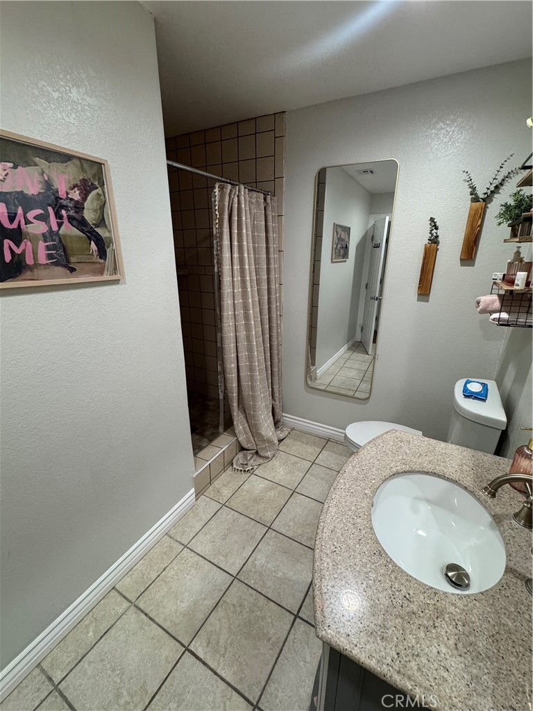 27914 West Shore Road Lake Arrowhead, CA 92352 - Photo 15 of 22 a bathroom with a sink and mirror