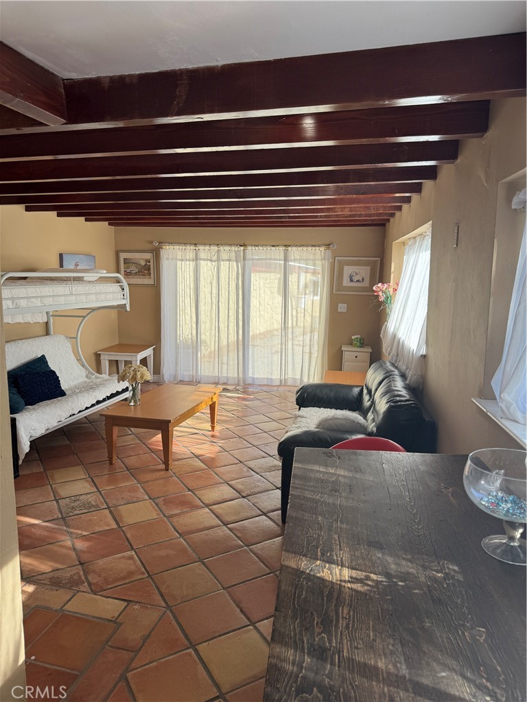 27914 West Shore Road Lake Arrowhead, CA 92352 - Photo 18 of 22 a living room with furniture and a chandelier
