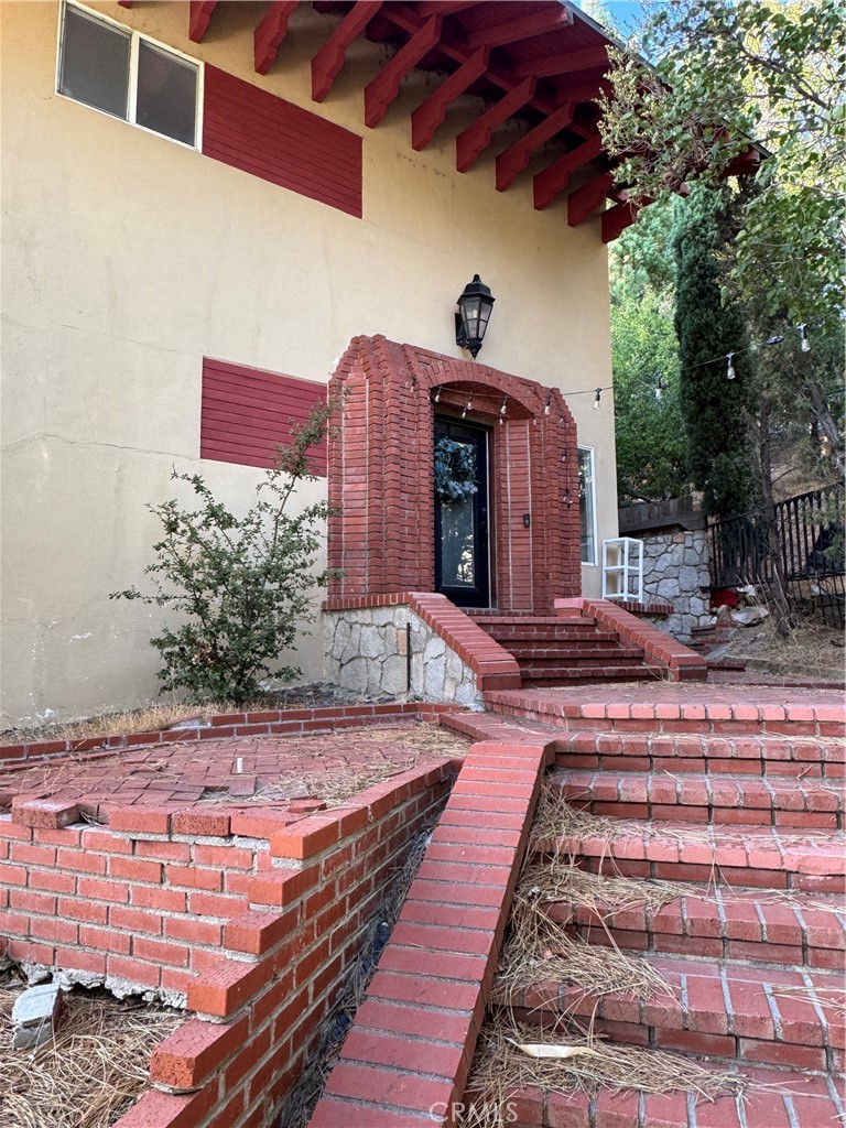 27914 West Shore Road Lake Arrowhead, CA 92352 - Photo 2 of 22 a view of a backyard with sitting area