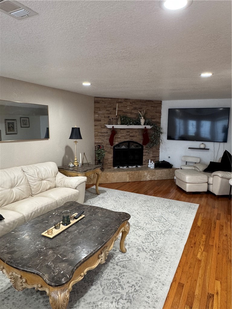 27914 West Shore Road Lake Arrowhead, CA 92352 - Photo 22 of 22 a living room with furniture and a flat screen tv