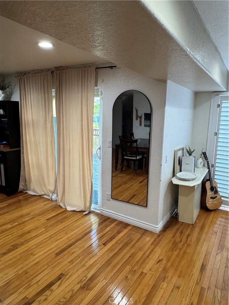 27914 West Shore Road Lake Arrowhead, CA 92352 - Photo 3 of 22 a view of empty room with wooden floor and fan