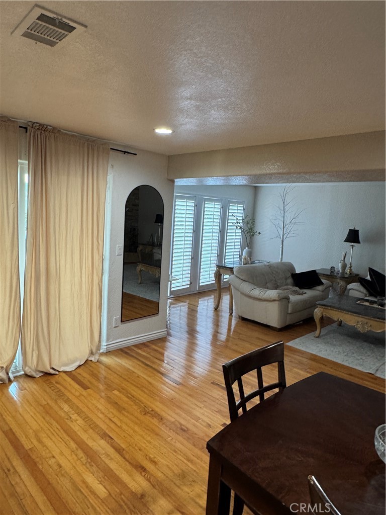 27914 West Shore Road Lake Arrowhead, CA 92352 - Photo 7 of 22 a living room with furniture and a wooden floor