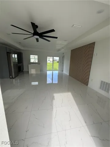 a view of an empty room with windows