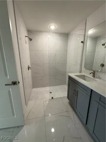 a view of a livingroom with a ceiling fan and window