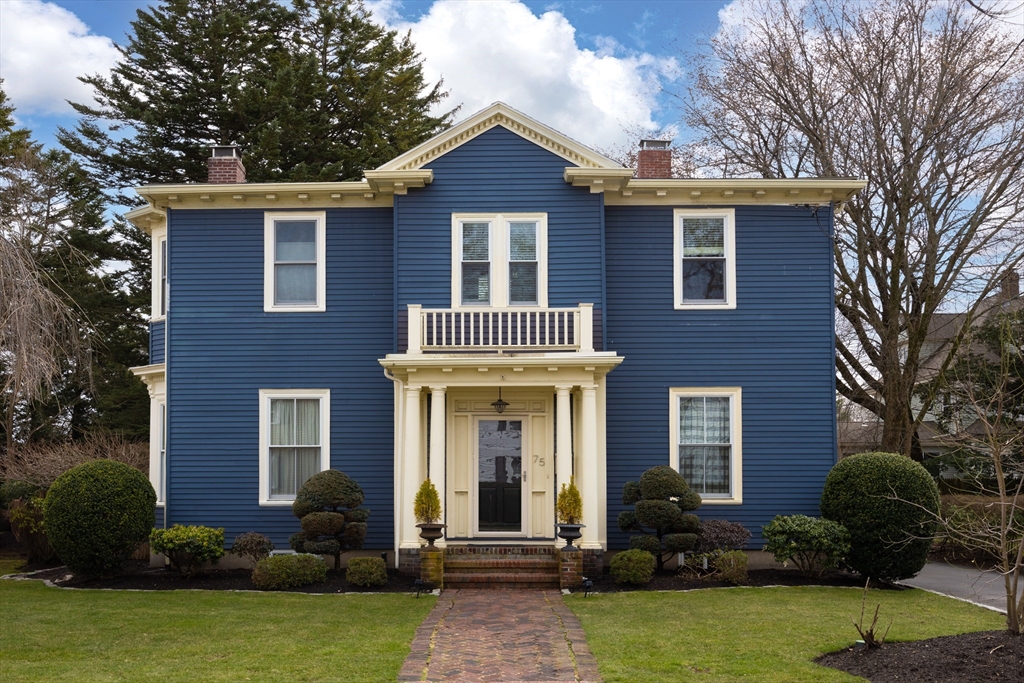 75 Clinton Place Newton, MA 02459 - Photo 1 of 18 a front view of a house with yard and porch