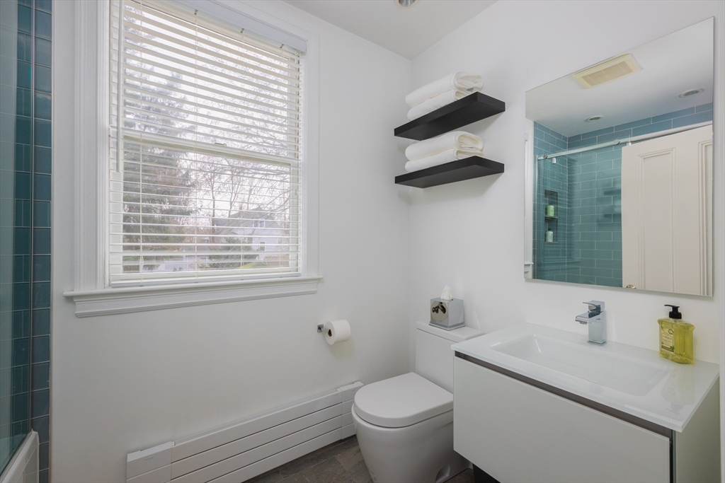75 Clinton Place Newton, MA 02459 - Photo 13 of 18 a bathroom with a sink and a toilet