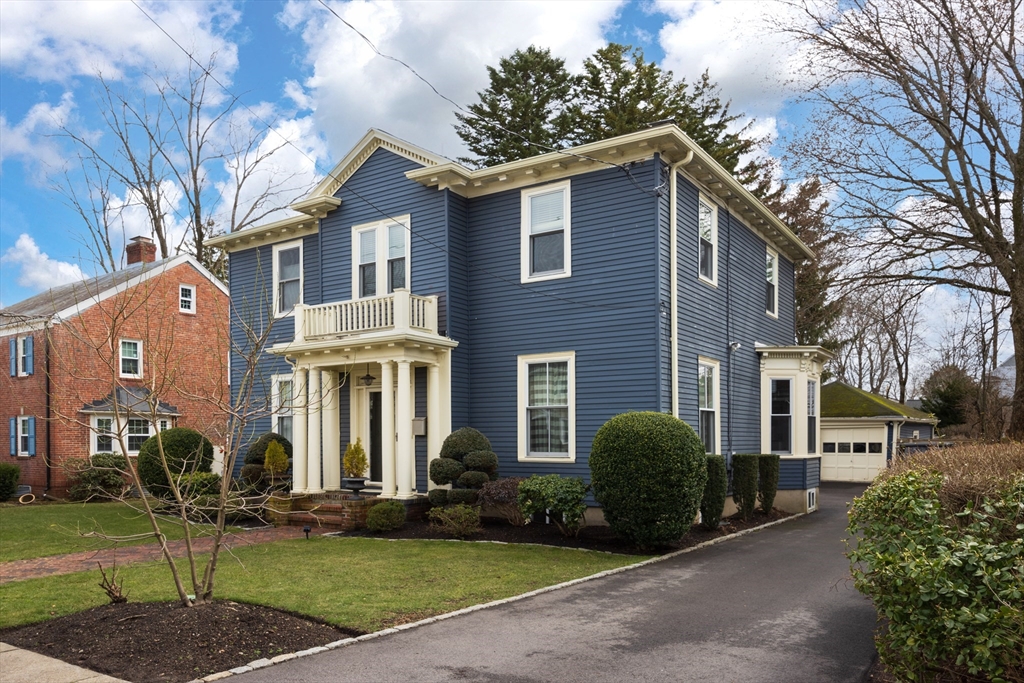 75 Clinton Place Newton, MA 02459 - Photo 2 of 18 a front view of a house with a yard