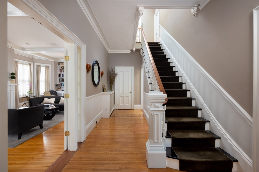 75 Clinton Place Newton, MA 02459 - Photo 3 of 18 a view of a hallway view with wooden floor and staircase
