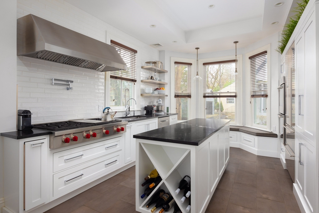 75 Clinton Place Newton, MA 02459 - Photo 5 of 18 a kitchen with cabinets and window
