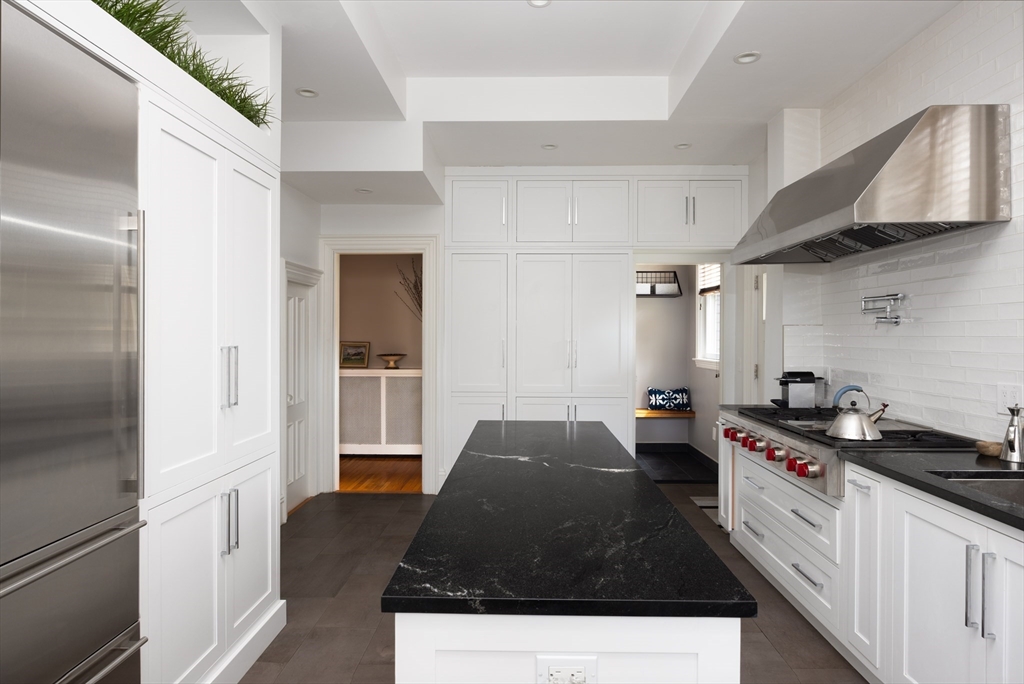 75 Clinton Place Newton, MA 02459 - Photo 6 of 18 a kitchen with a sink and a stove top oven